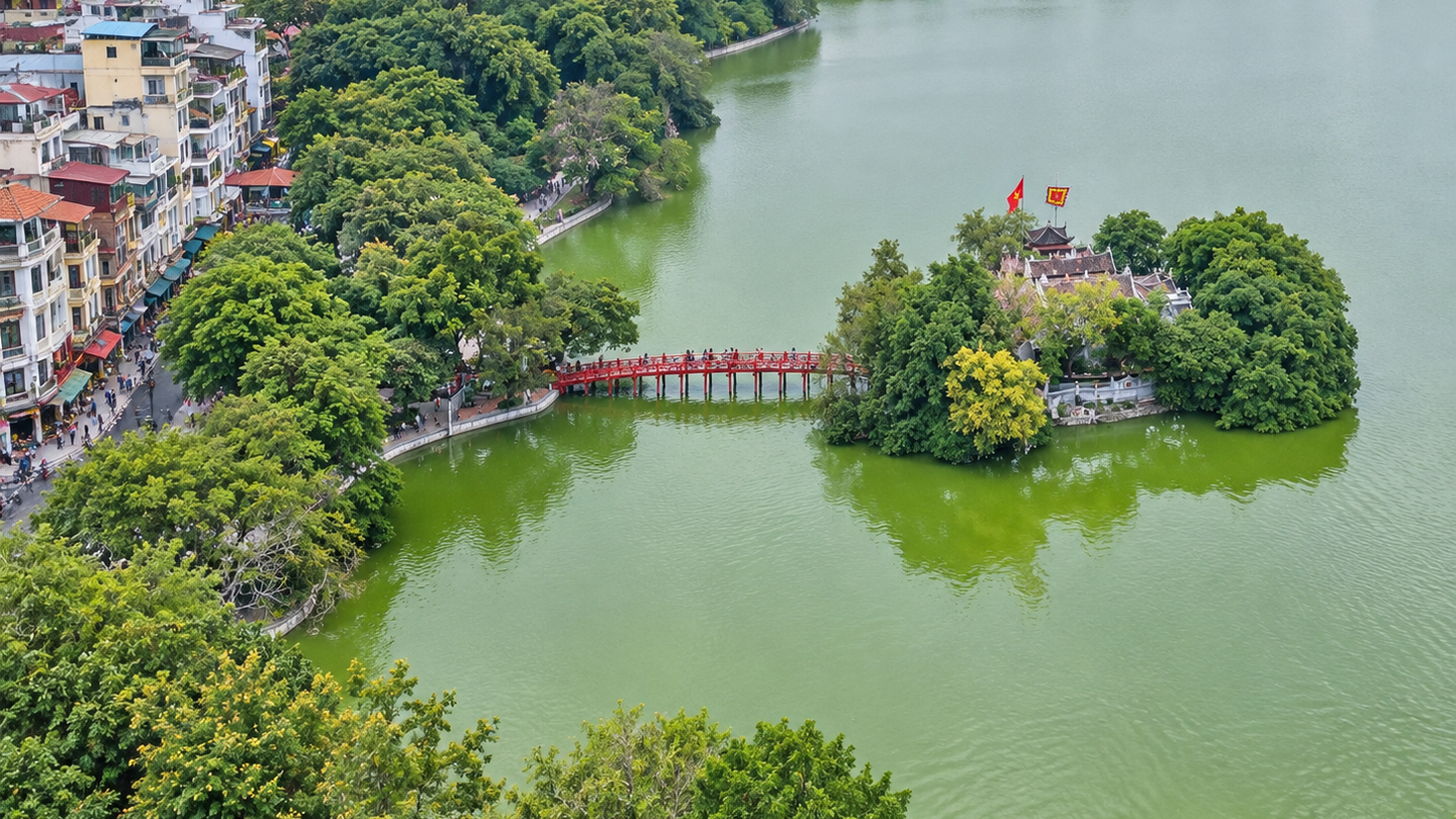 The red Huc Bridge leading to Ngoc Son Temple on Hoan Kiem Lake