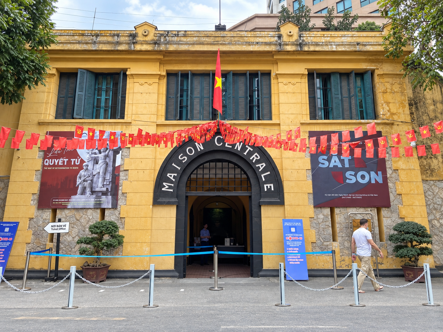 Visitors approach the entrance to Hoa Lo Prison Relic in Hanoi.