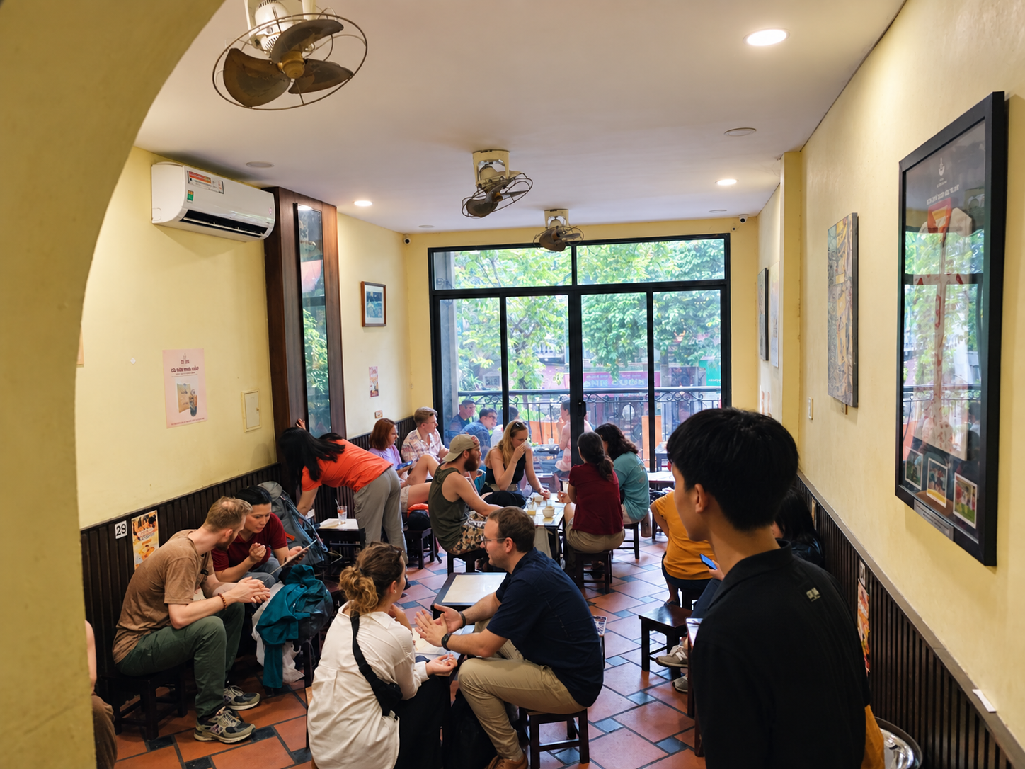 Customers sit inside Cafe Giang at 39 Nguyen Huu Huan in Hanoi.