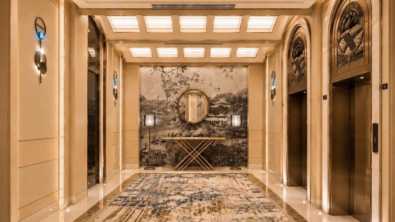 A lift lobby with a painted landscape mural