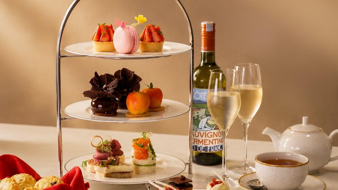 An afternoon tea stand of cakes